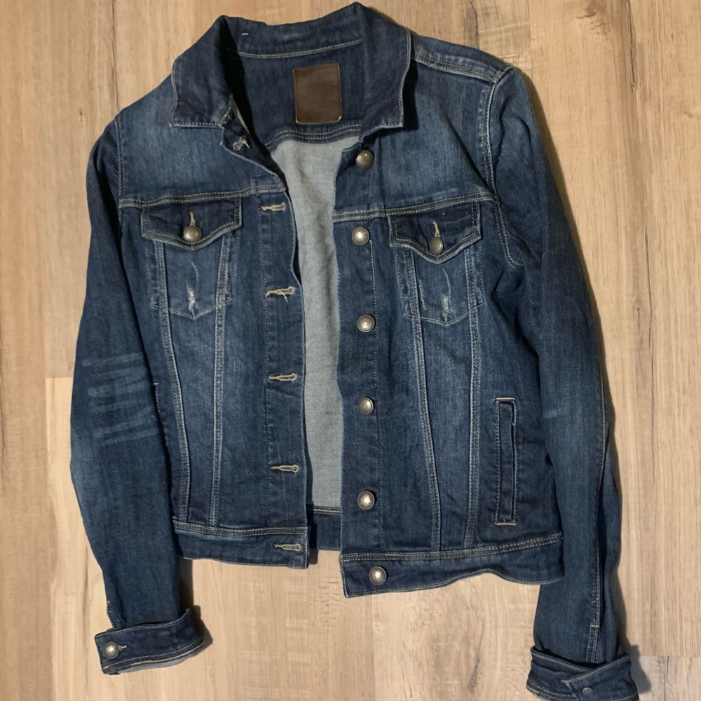 Distressed woman’s jean jacket - size medium